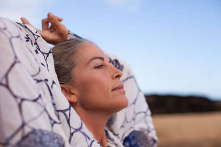 Beautiful Woman out in Nature looking upの写真素材