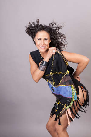 Beautiful Woman Dancing in a funky outfitの写真素材