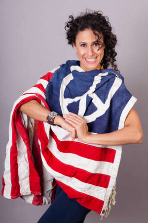 Woman draped in a Flag with a Peace Sign on itの写真素材