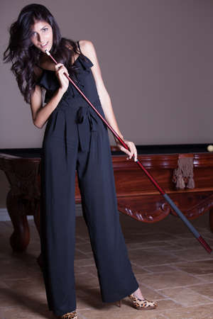 Beautiful woman playing billiardsの写真素材