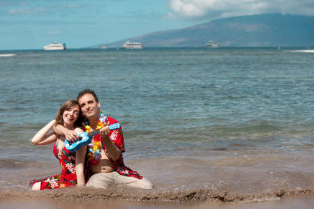 Man Serenading his new bride with a Ukelele in Hawaiiの写真素材