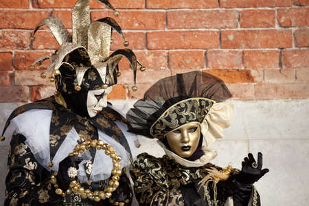 Beautiful costumed women in Venice Italy at Carnival in Februaryの写真素材