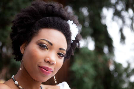 Beautiful African American woman in the park looking at Cameraの写真素材