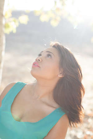 Beautiful mixed race young woman in natureの写真素材