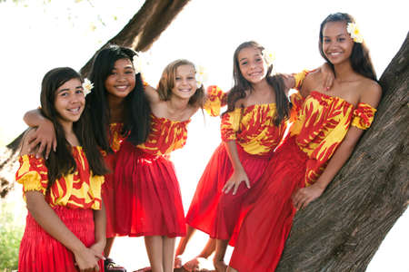 Group of fivePolynesian Hula girls  in Friendship looking at cameraの写真素材