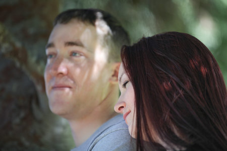 Man and woman under a tree hugging