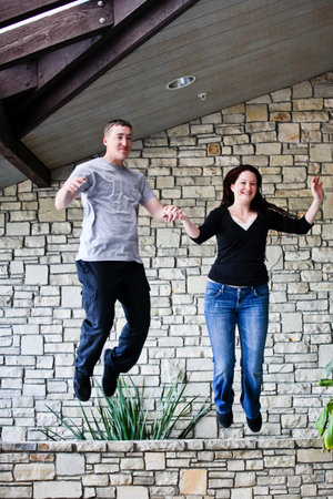Young newleywed couple Jumping for Joy 