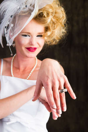 Happy Beautiful Bride showing off her ring with hand outstretchedの写真素材