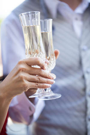 Focus on the glasses couple having a Champagne Toastの写真素材