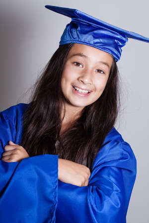 Smiling cute young graduate in Blue cap の写真素材