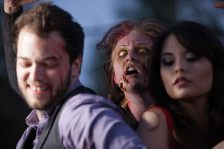 Zombie attacking a coupleの写真素材