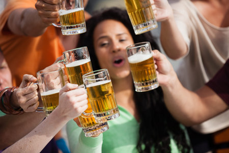 Group of Attractive young People toasting with a delicious Pale Ale  Beer