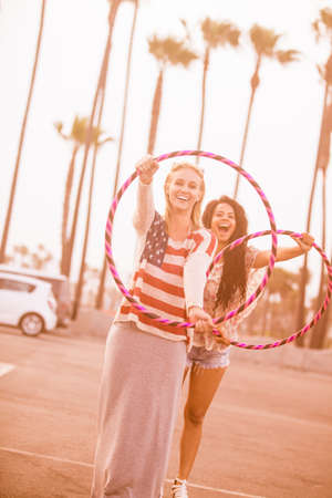 Young Woman having fun at the beach with Hoops in Venice Beach Californiaの写真素材