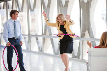 Group of Mature Adults taking a play Break in a modern office to get ideas flowingの写真素材