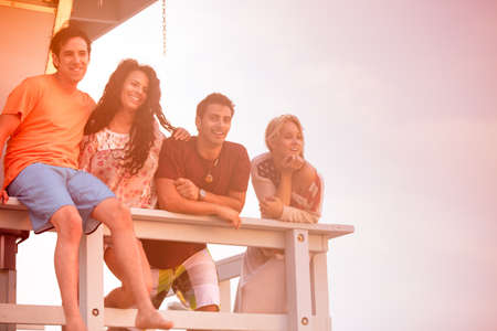 Young Group of Friends at the Beach at Sunset in Southern Californiaの写真素材