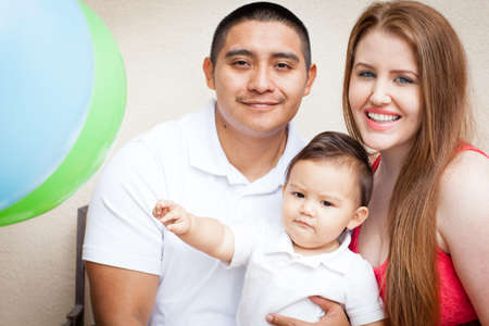 Happy young Family on Babies first Birthdayの写真素材