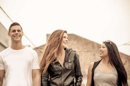 Group of young people walking and talkin in Downtown Los Angelesの写真素材