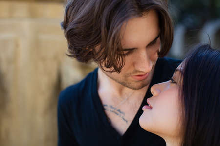 Beautiful blissful Young couple about to kissの写真素材