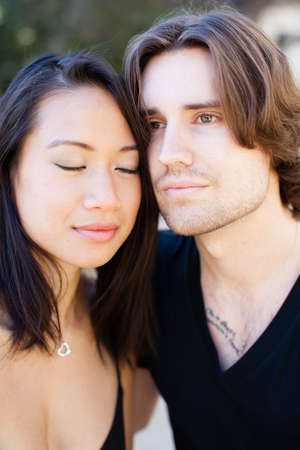 Beautiful blissful Young couple cheek to cheekの写真素材