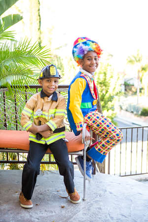 Brothers in costume ready to trick or treatの写真素材