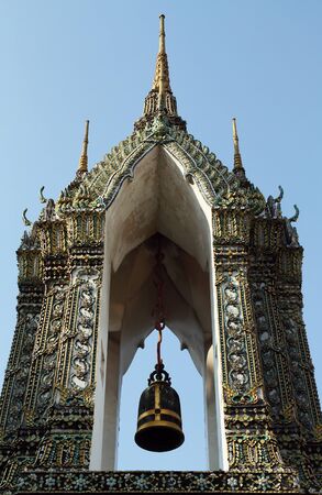 bell tower with Thai style decoration at a templeの写真素材