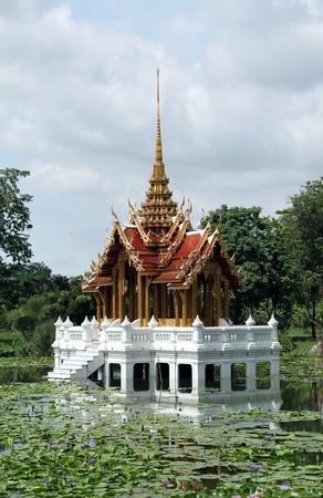 Thai model of royal castle or sanctuary on waterの写真素材