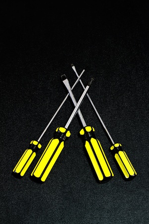 four screw driver arranged in triangle arrangmentの写真素材