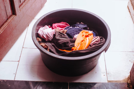 laundry clothes in black plastic bowl