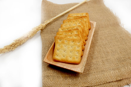Sugar coated biscuits, sugarless healthy malkist cracker biscuits on white background isolatedの写真素材