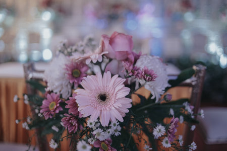 floral accents on the backs of chairs for weddingsの写真素材