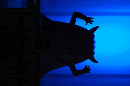 monster silhouette on blue backgroundの写真素材