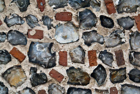 An exterior flint stone and brick wallの写真素材