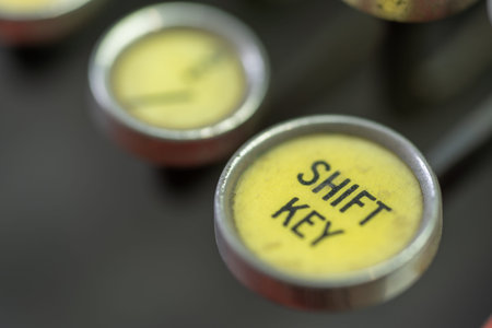 A closeup of the shift key of an antique typewriter.の写真素材