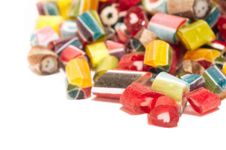 bright and juicy lollipops of different colors isolated on a white background. Top view. Close upの写真素材