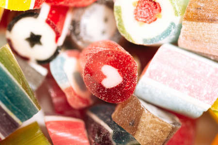 bright and juicy lollipops of different colors isolated on a white background. Top view. Close upの写真素材