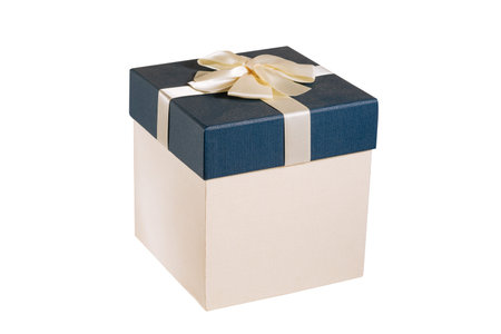 Red gift box with ribbon bow isolated on white background. Close-up
