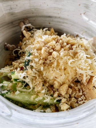 healthy salad with chicken, mushrooms and walnuts