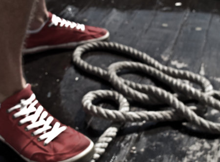 Red sneakers with a rope