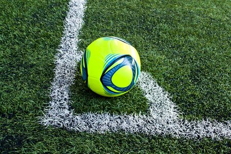 a ball on the green glass at the corner pointの写真素材