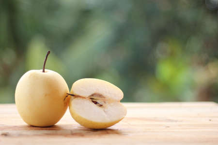 Yellow pear,yali pear fruit on wooden tableの写真素材