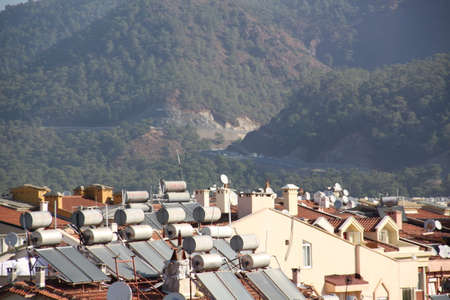 Solar water heating systems on the roofs of the city of Marmaris, Turkeyの写真素材