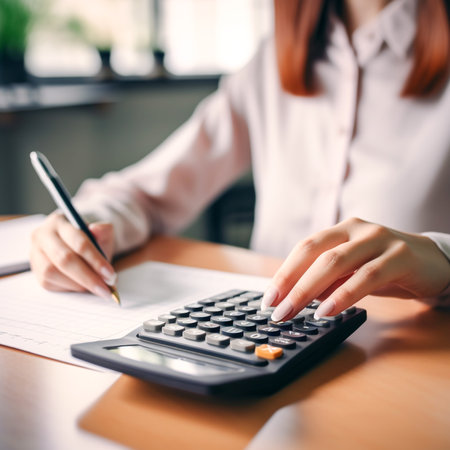 Modern AI-Generated Woman Working with Calculator in Office - Business Finance and Technology Conceptの素材