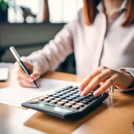 Modern AI-Generated Woman Working with Calculator in Office - Business Finance and Technology Conceptの素材