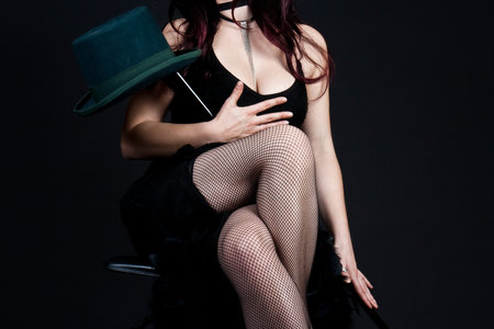 Glamor woman with corset and hat