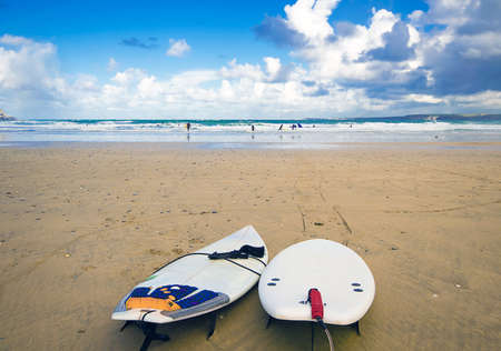 Surfboards on the beach at Tolcarne Beach, Newquay,UK.の写真素材