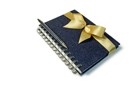 Gift set including a notebook and the pen, isolated on a white background.の写真素材