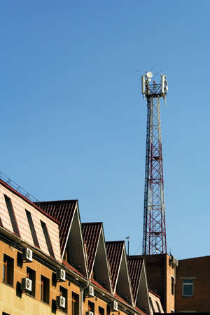 Cellular communication antenna on a roof of a building.の写真素材