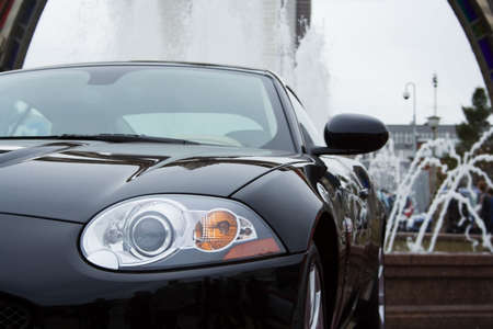 The modern sports car at a fountain.の写真素材
