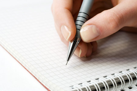 Female hand writing.