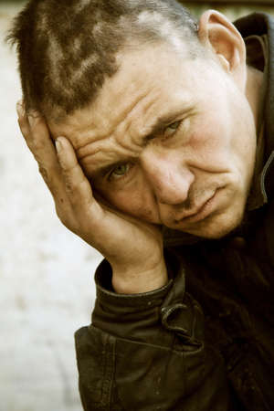 One more hard day of a homeless beggar.の写真素材